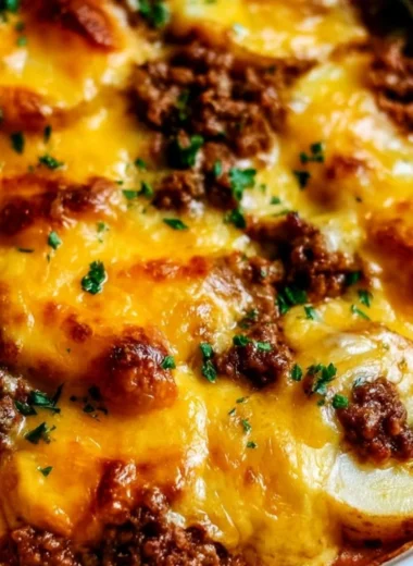 Hobo Casserole featuring ground beef and sliced potatoes in a casserole dish
