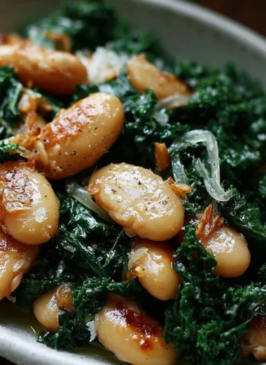 Pan-fried beans served with sautéed kale in a vibrant dish