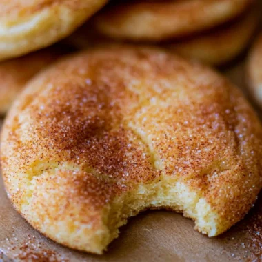 Freshly baked perfectly soft and chewy snickerdoodle cookies on a cooling rack