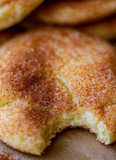 Freshly baked perfectly soft and chewy snickerdoodle cookies on a cooling rack