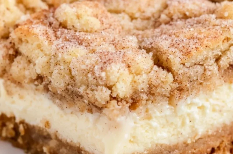 Delicious snickerdoodle cheesecake bars topped with cinnamon sugar