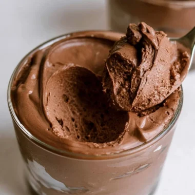 Delicious bowl of the creamiest chocolate mousse topped with chocolate shavings