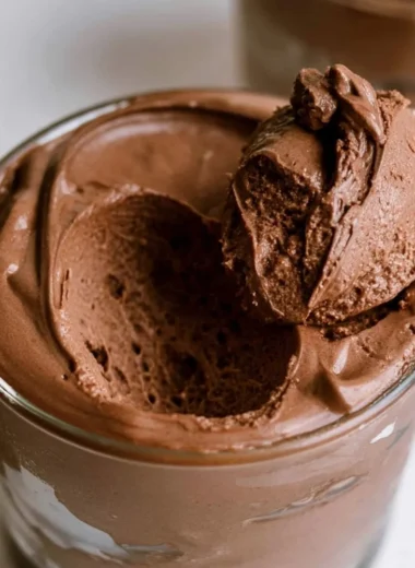 Delicious bowl of the creamiest chocolate mousse topped with chocolate shavings