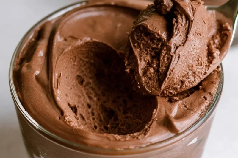 Delicious bowl of the creamiest chocolate mousse topped with chocolate shavings